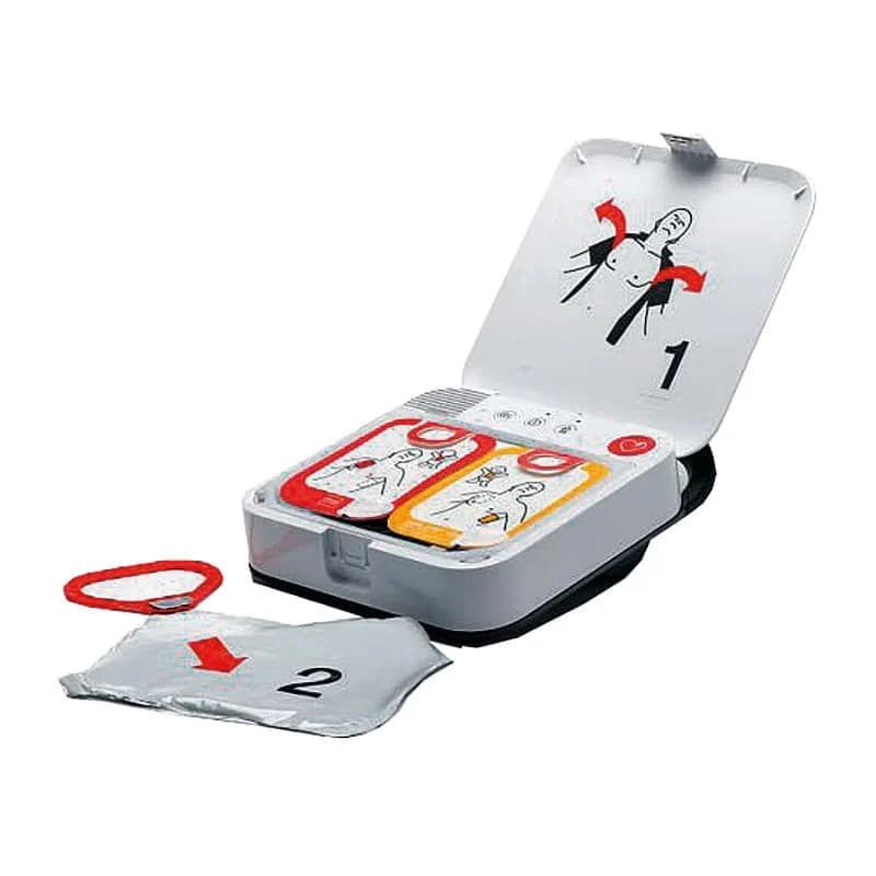 Défibrillateur LIFEPAK CR2 ouvert présentant son système d'électrodes QUIK-STEP et les instructions de préparation.